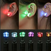 A set of LED light-up flashing stud earrings with color-changing zircon stones shown in various colors and mounted on pins.