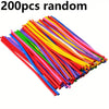 A pile of 200 random multicolor latex modeling balloons in various bright colors.