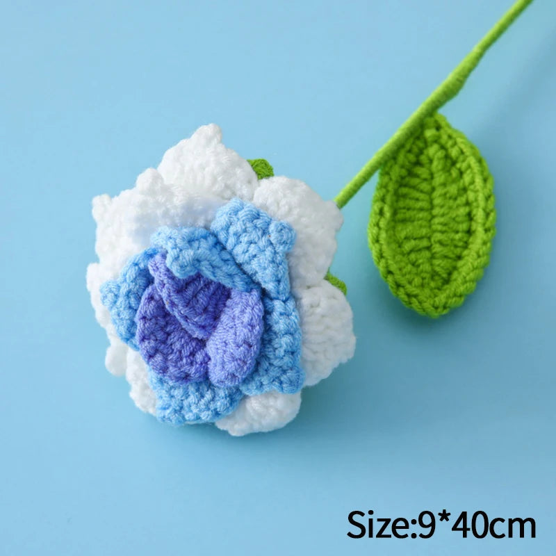 Handmade crochet tulip bouquet featuring white and purple flowers on a green stem