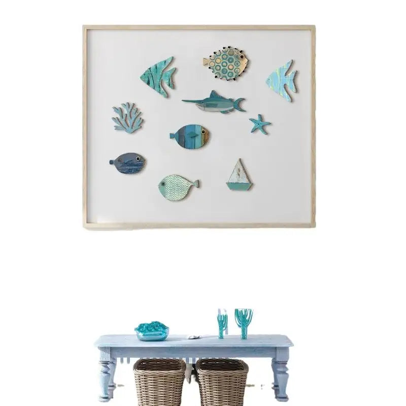 A collection of ten wooden hanging fish wall decorations in various shades of blue and green displayed on a white background.