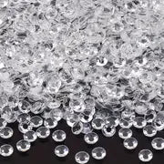 A pile of clear, round resin rhinestones in various sizes and colors.
