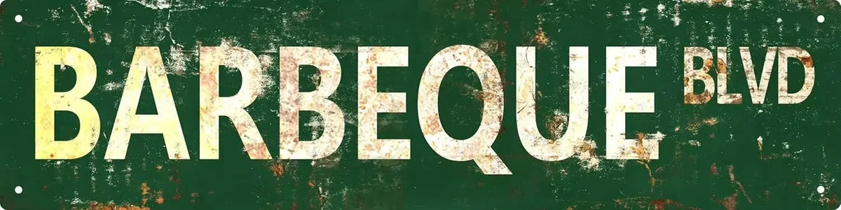 A distressed, vintage-style metal sign with the text BARBEQUE BLVD in large, weathered yellow letters against a dark green ba