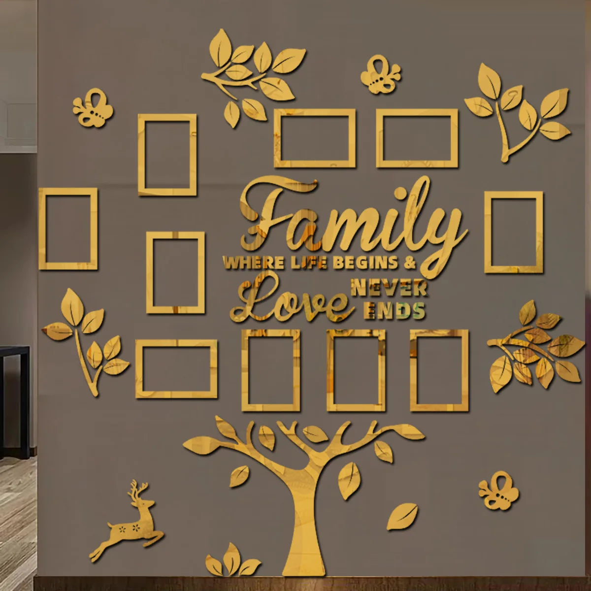 A gold-colored wall collage featuring a family tree design with leaves and framed shapes.