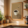 A framed canvas print depicting a silhouette of a person climbing a ladder toward a cup of coffee against a neutral backgroun
