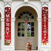 Two vertical red Christmas banners decorated with snowflakes and greenery flanking a beige arched doorway.