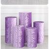 Purple spandex cylinder stand covers displayed in various sizes and rolled fabric samples.