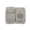 A pair of gray knitted kids socks with a textured pattern.