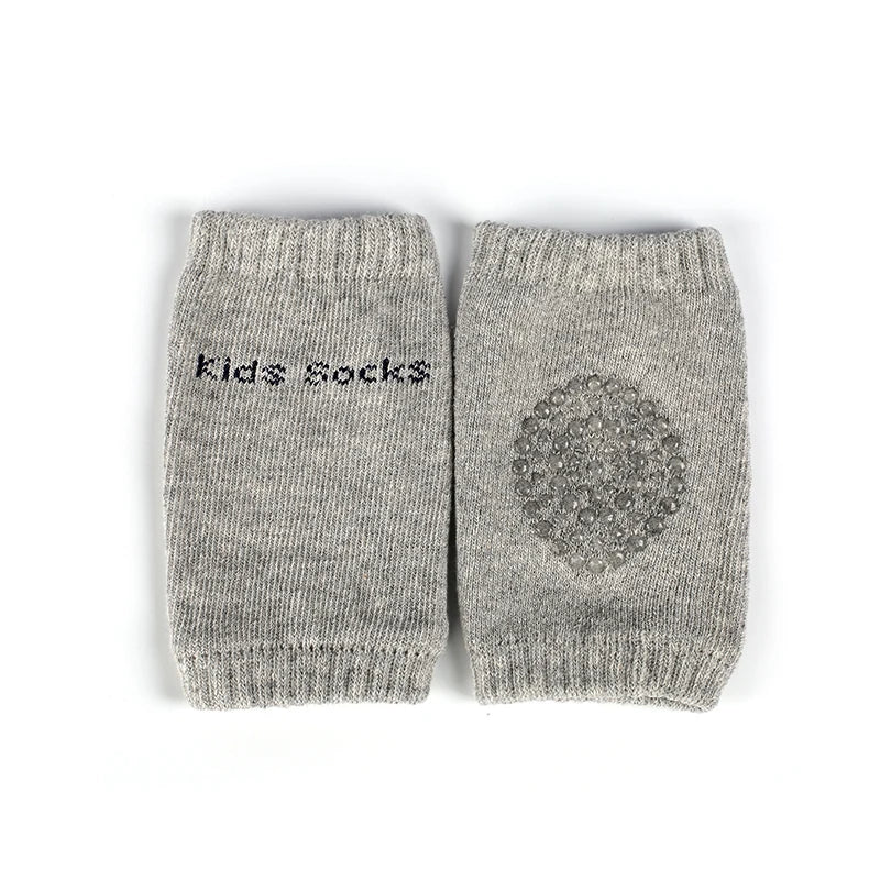 A pair of gray knitted kids socks with a textured pattern.