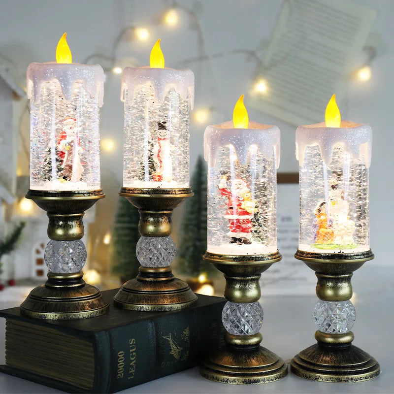 A set of four clear glass candles with yellow flames displayed on ornate gold stands.