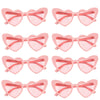 Pair of pink heart-shaped party sunglasses with pink frames and orange tinted lenses