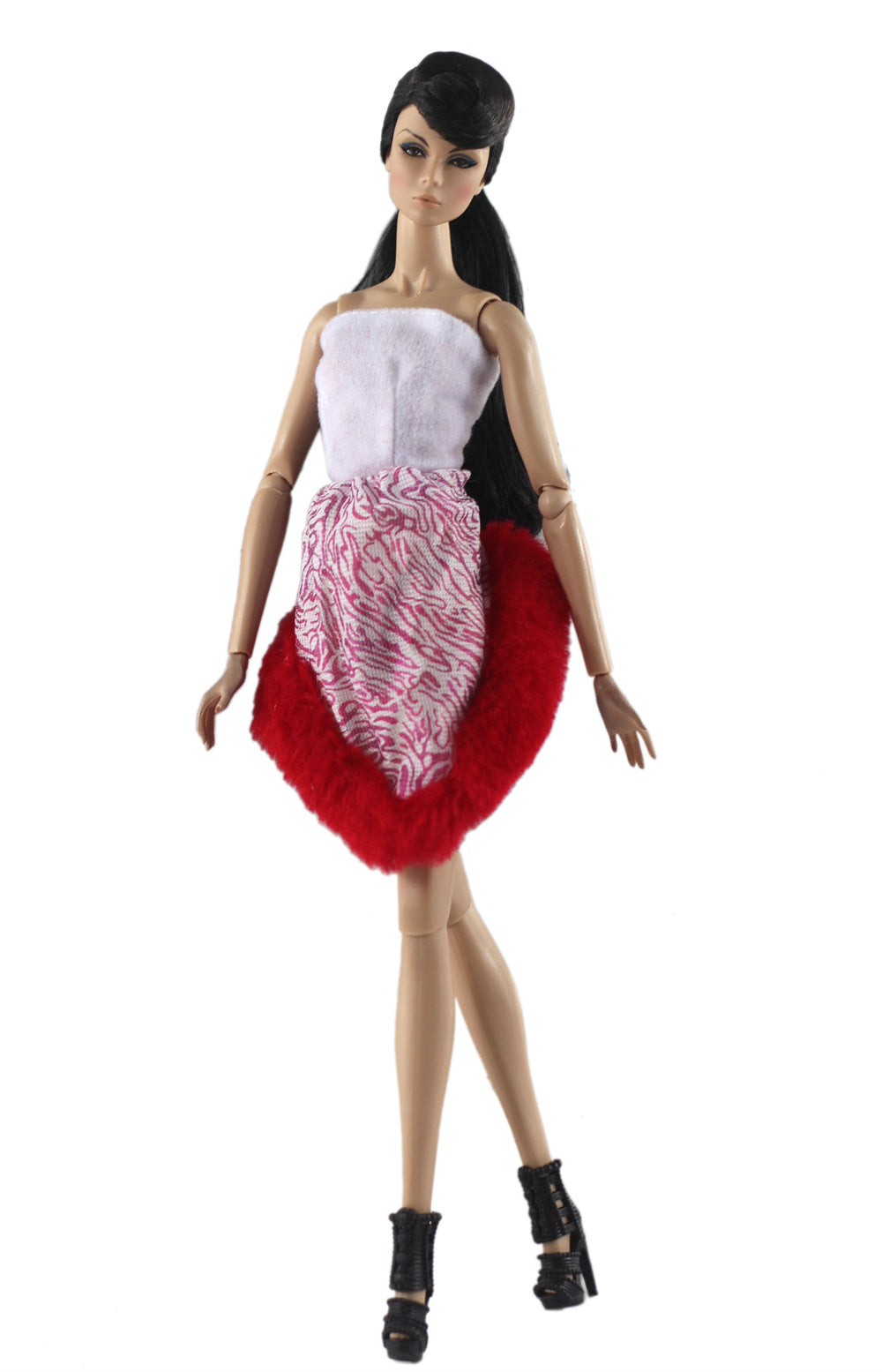 A handmade doll dress gown featuring a white top and a pink patterned skirt with a red ruffled trim.