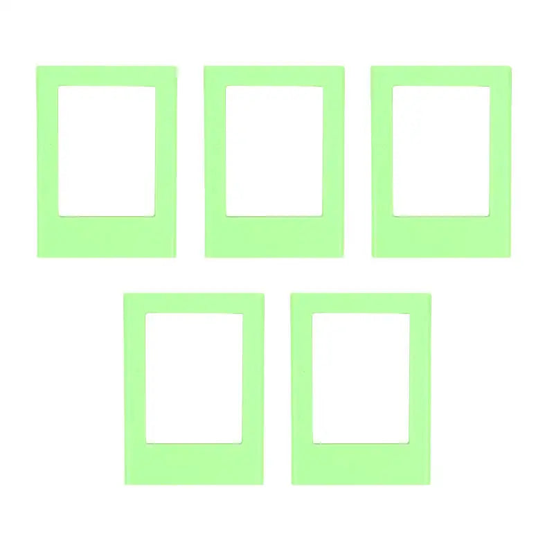 A set of five light green rectangular photo frame magnets.