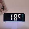 A black digital alarm clock displaying 1:08 with a blue light and a week day schedule.
