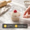 Clear plastic cupcake boxes filled with frosting and raspberries, demonstrating high clarity and seal strength.