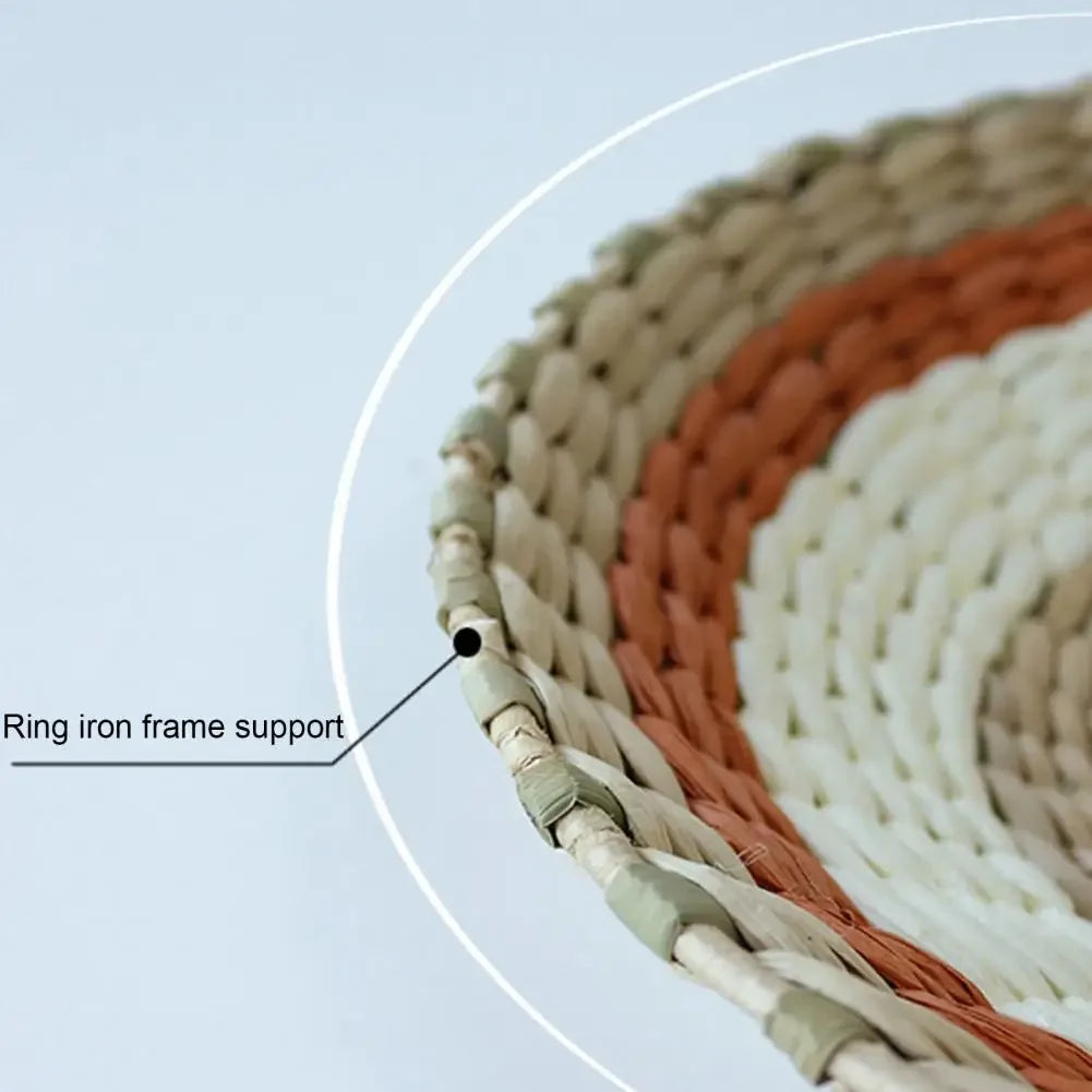 Close-up view of a woven straw ring with an iron frame support used for bohemian wall decor hanging