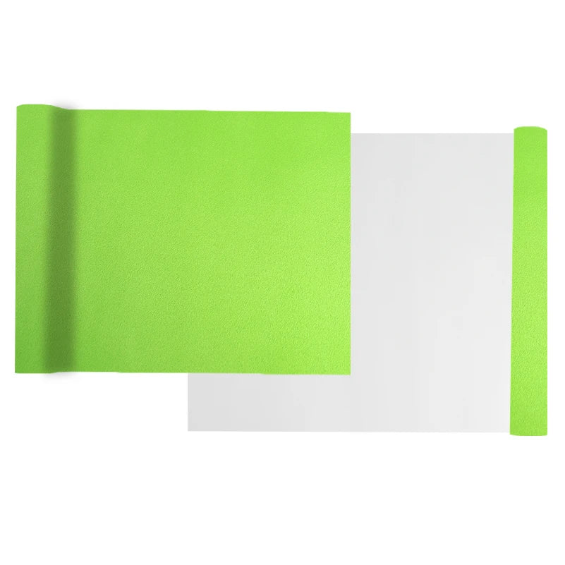 A bright lime green self-adhesive suede wrap fabric shown next to a white sheet.