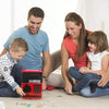 A family is playing with a red piggy bank coin money saver on the floor.