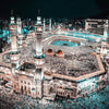 Night view of a mosque with minarets and a courtyard filled with people, illuminated by blue lights.