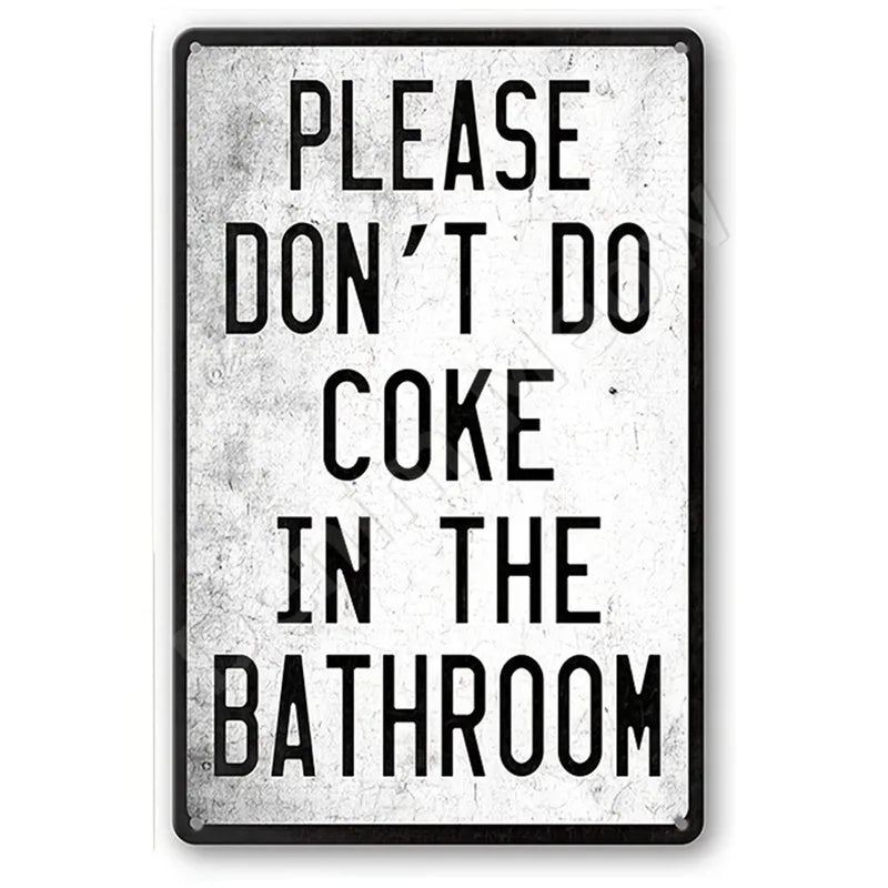 A black metal sign with white text that reads PLEASE DON'T DO COKE IN THE BATHROOM