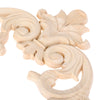A light wood carving of a branch and crown design used for European decor.