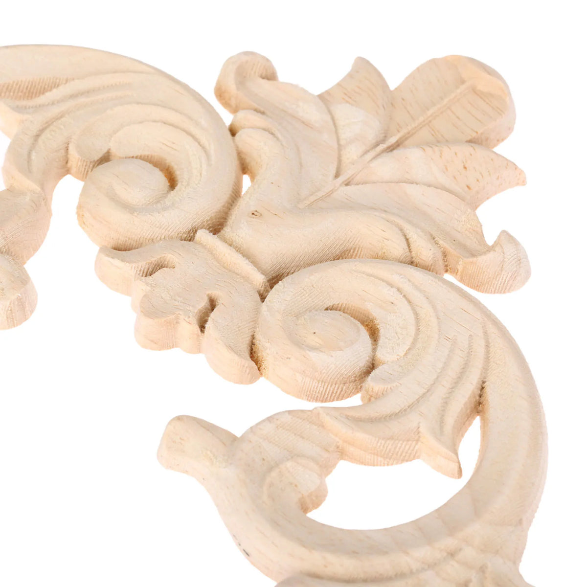 A light wood carving of a branch and crown design used for European decor.