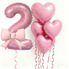 Pink foil balloons shaped like the number 2 and heart for party decoration