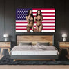 A bedroom setting featuring a bed with a USA flag tapestry artwork above it.