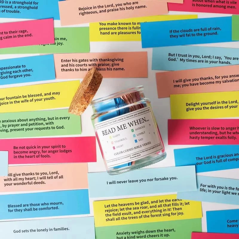 A clear glass jar filled with color-coded Bible verses for emotional guidance