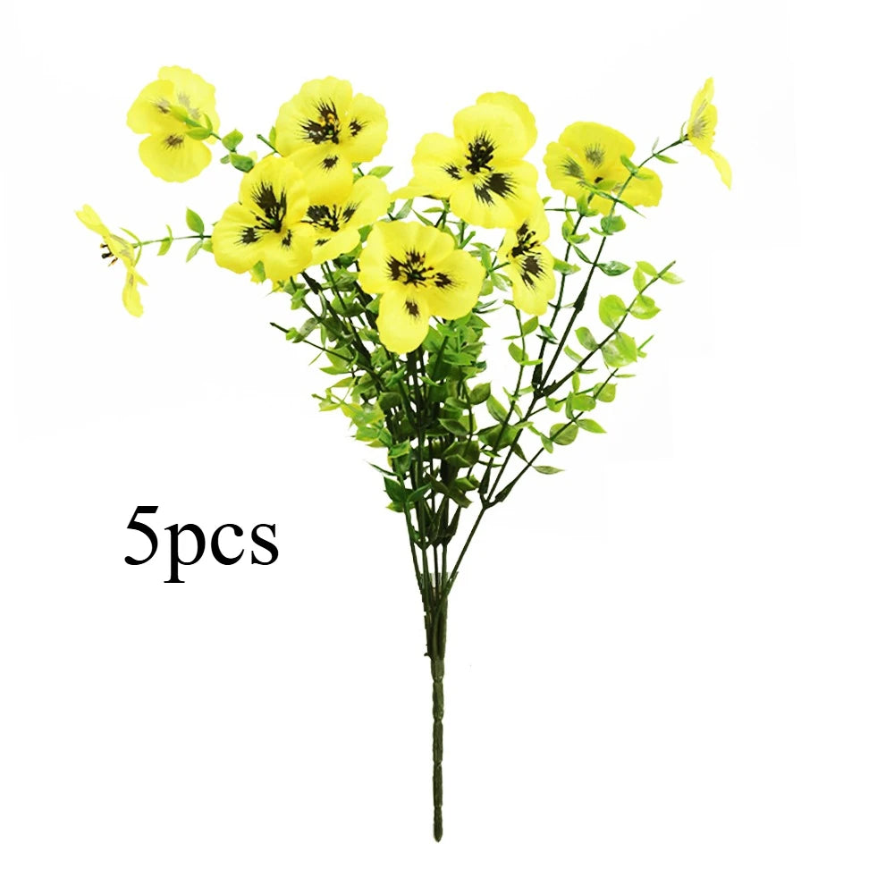 A bouquet of five yellow artificial pansy flowers on a green stem.
