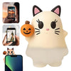 A white cat-shaped LED light decoration with black ears and whiskers, featuring a carved pumpkin face.