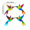 Colorful metal hummingbird wall art featuring vibrant iridescent feathers in various shades of blue, green, and orange.