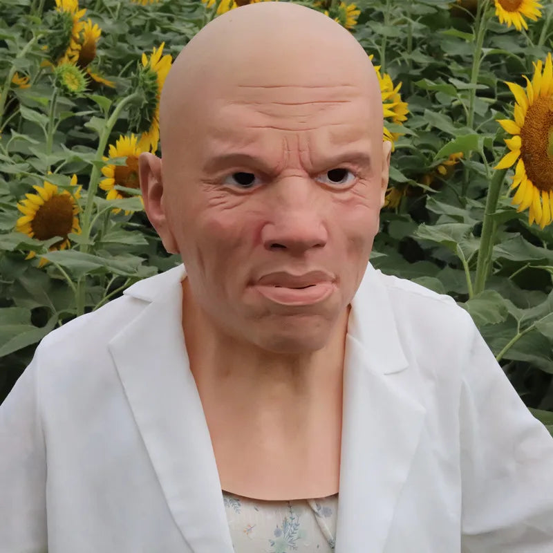 A realistic cute alien full-face latex mask with a bald head and intense expression wearing a white lab coat.
