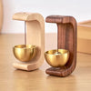 A pair of wooden magnetic wind chimes shaped like doorbells, featuring brass-colored bowls and hanging from wooden frames.