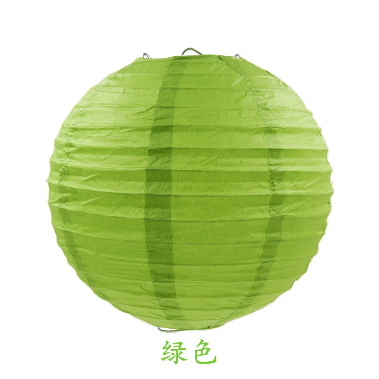 A round, lime green paper lantern with vertical folds.