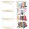 Wall-mounted headband holder displaying various colored hair accessories and headbands.