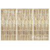 Three panels of metallic gold foil fringe curtains used for party backdrop decor.
