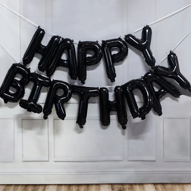 Black foil letter balloons spelling out Happy Birthday decoration set