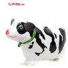 A white and black cartoon cow foil balloon for birthday party decor.