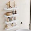 A modern wooden floating wall shelf organizer displaying various skincare and cosmetic products.