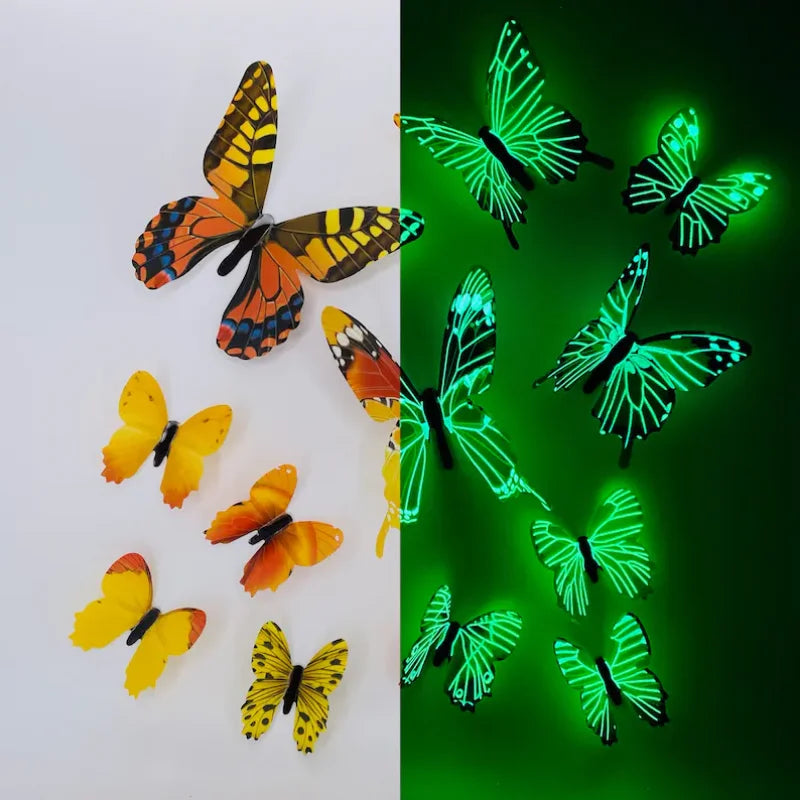 A collection of twelve luminous, glowing butterfly wall stickers in various shades of orange, yellow, and green against a whi