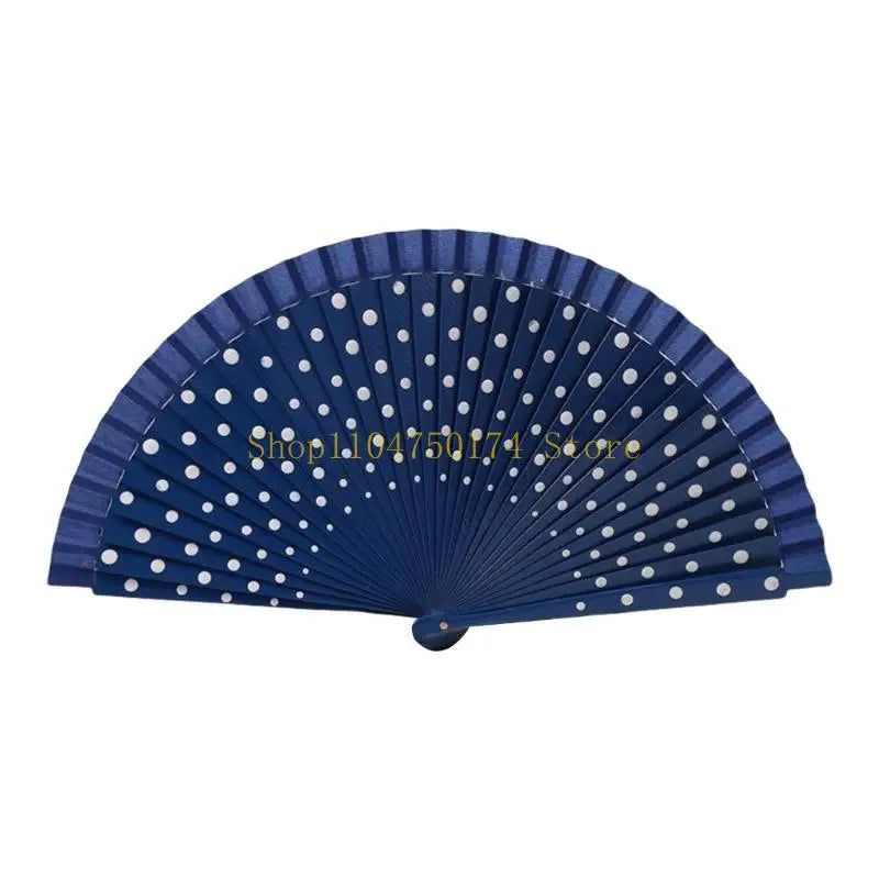 A dark blue wooden hand fan with white polka dots, shown in a fan shape.