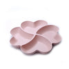 A pink heart-shaped four-compartment silicone snack tray with rounded edges.