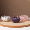 A set of natural crystal droppers used for Reiki and meditation, featuring purple and pink crystals in bowls.