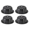 A set of four black nonstick mini fluted cake pans arranged in a 2x2 grid.