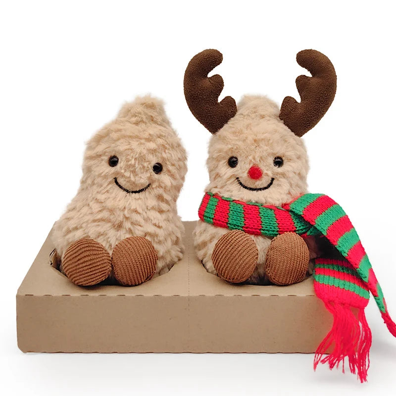A pair of Christmas plush toys featuring reindeer heads with antlers and a festive scarf.