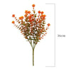 A bouquet of orange artificial daisies on a green stem, suitable for autumn home decor.
