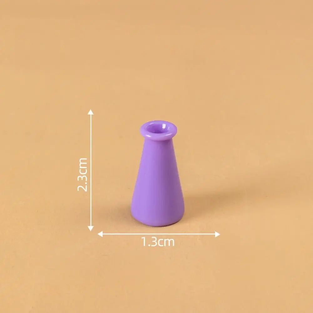 A small, purple miniature resin vase with a narrow neck is shown against a plain background.