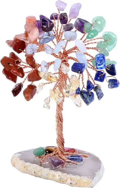 A crystal money tree decor featuring various colored crystals branching out from a wooden base.
