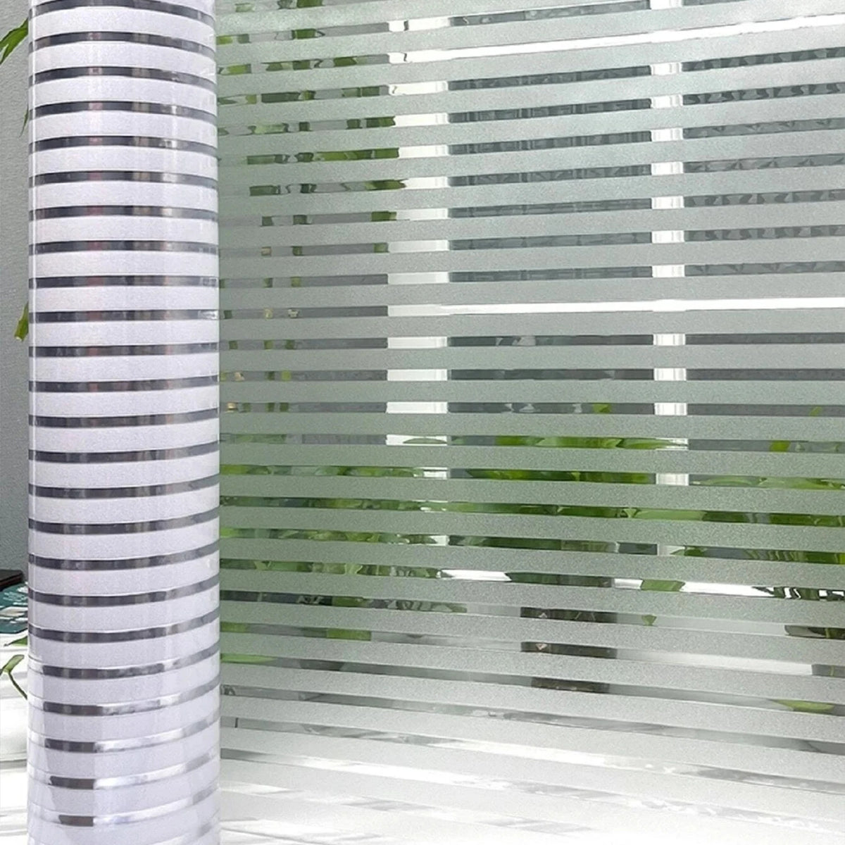 Vertical frosted window privacy film with horizontal stripes providing diffused light and privacy.