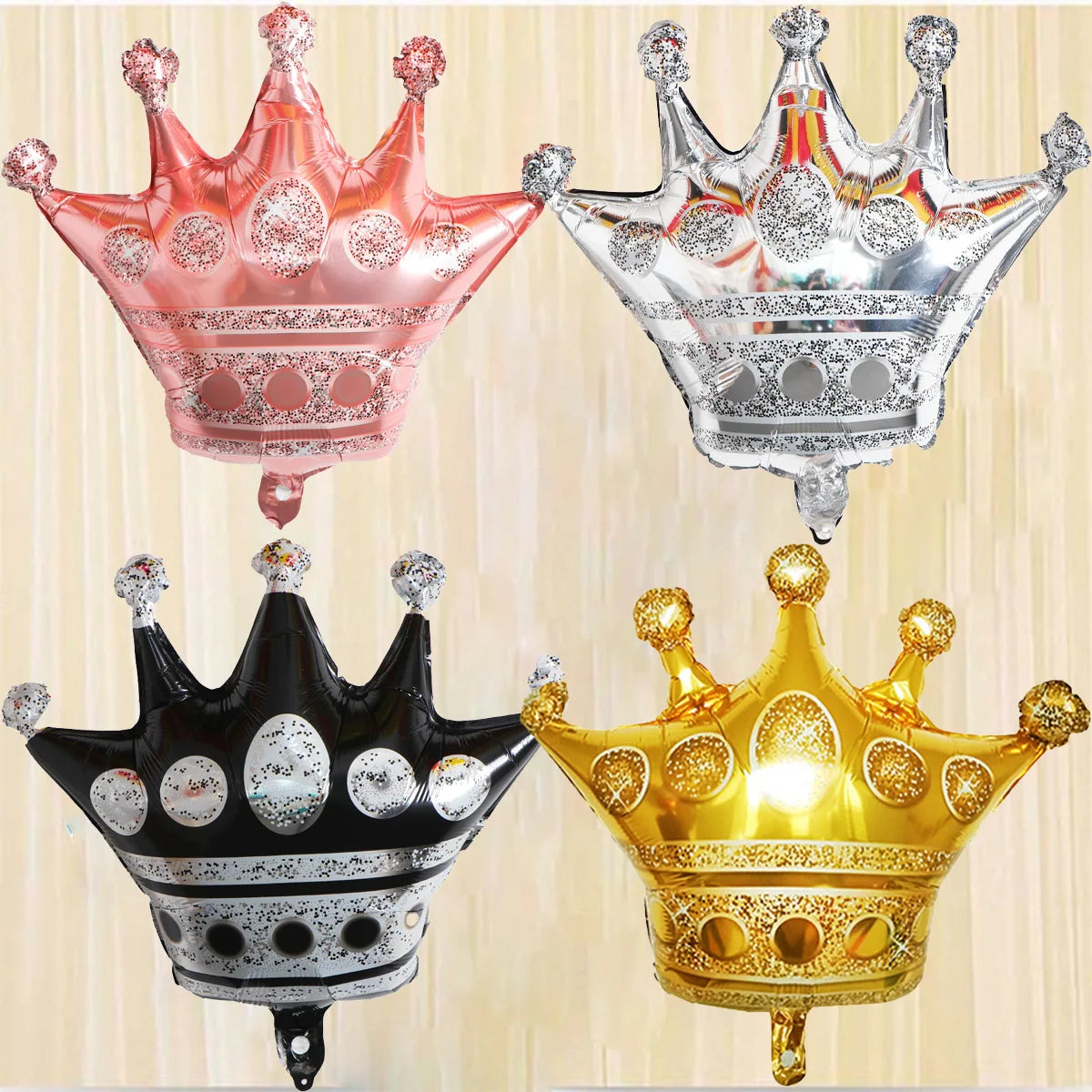 Three foil crown shaped balloons in pink silver and gold colors for birthday and party decoration